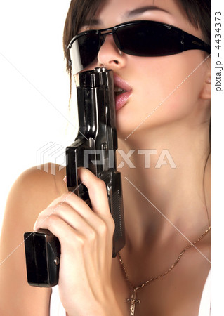 ガン 鉄砲 銃 吹くの写真素材