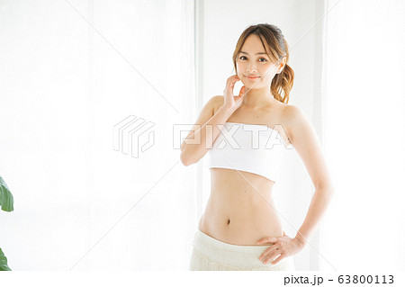 Slim Sport Girl Front Tanned Body in White Underwear Doing